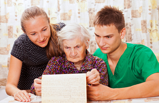 Elderly woman with the young doctors