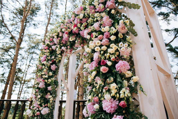 istock arch for the wedding ceremony, decorated with fresh flowers in a pine forest 657181136