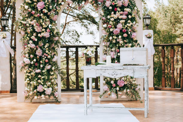 istock arch for the wedding ceremony, decorated with fresh flowers in a pine forest 657181292