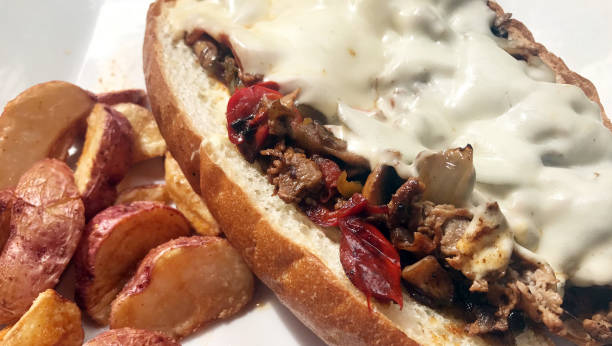 istock Steak hoagie sandwich with mushrooms, peppers and cheese. 657181766