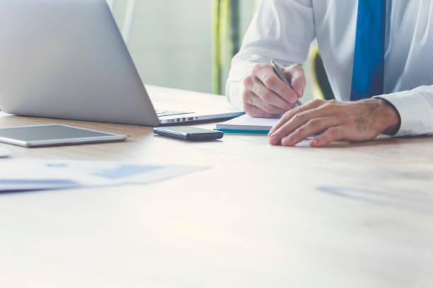 istock Unrecognizable businessman writing or signing. 657184290
