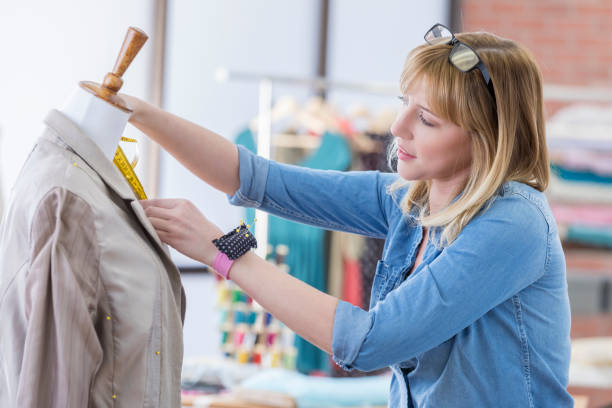 istock Fashion designer measures blazer 657187446