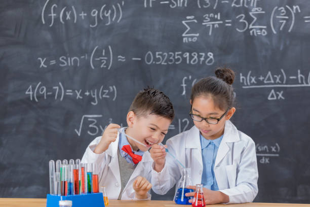 istock Happy young scientists in chemistry lab 657188142