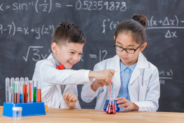 istock Young scientists conduct chemistry experiment at school 657188156