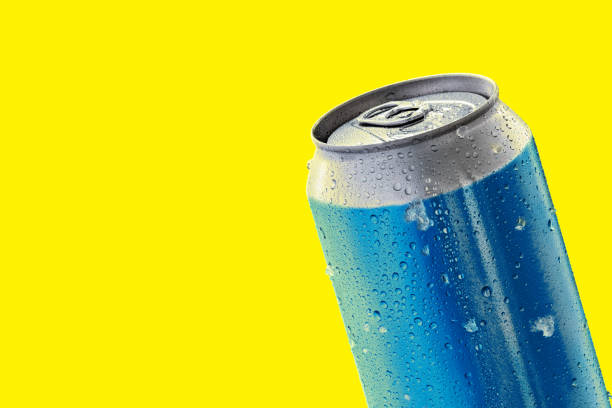 istock Shiny blue aluminium can over a yellow background. 657188454