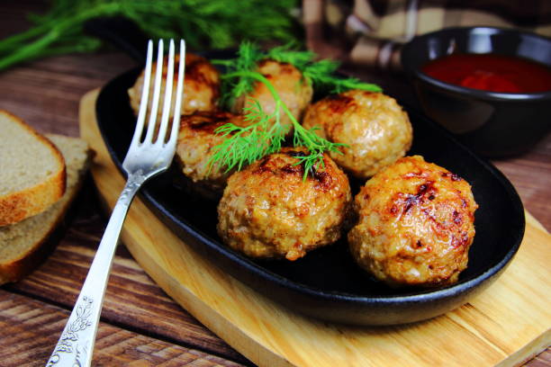 meat meatballs in a frying pan stock photo