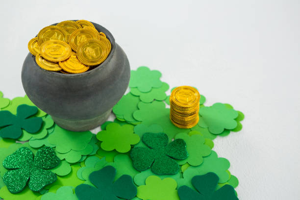 istock St. Patricks Day shamrocks and pot filled with chocolate gold coins 657189478