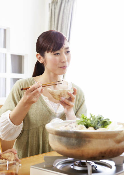 istock Young women eat chicken casserole 657193962