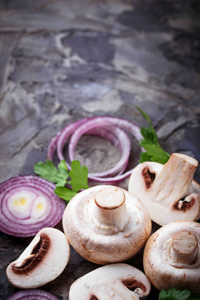 istock Fresh champignon mushrooms and red onion 657200580