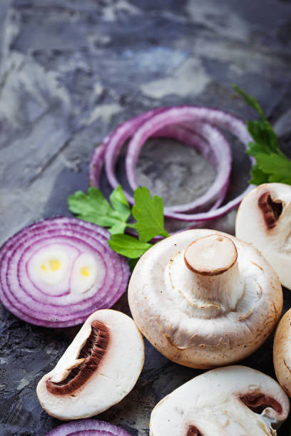 istock Fresh champignon mushrooms and red onion 657200582