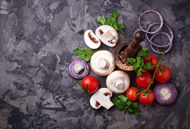 Champignon mushrooms, cherry tomatoes and red onion Champignon mushrooms, cherry tomatoes and red onion. Selective focus dissected flower stock pictures, royalty-free photos & images