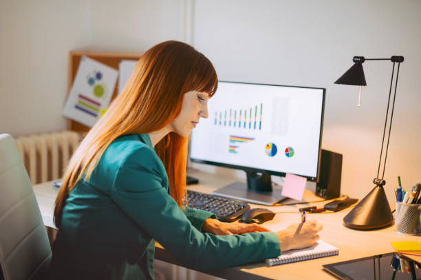 istock Dilligent businesswoman dealing with financial insturments and market data, making good decisions about future investments 657200920