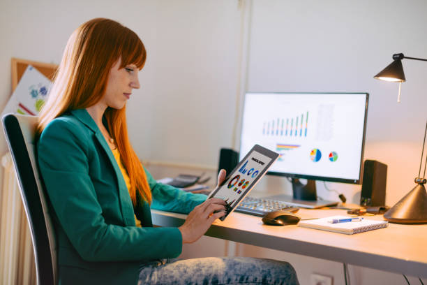 istock Dilligent businesswoman dealing with financial insturments and market data, making good decisions about future investments 657200964