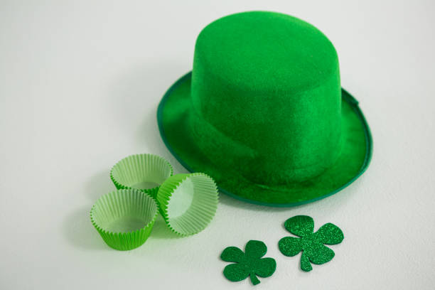 istock St Patricks Day leprechaun hat with shamrock and cup cake case 657210940