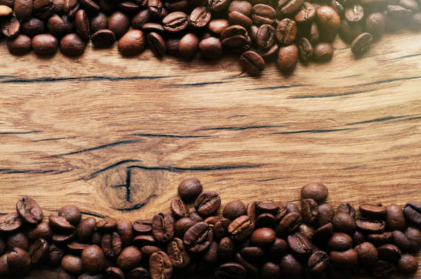 istock Coffee beans on grunge wooden background 657214276