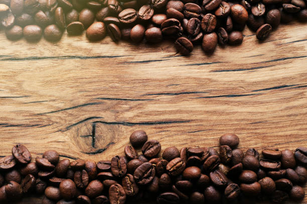 istock Coffee beans on grunge wooden background 657214364