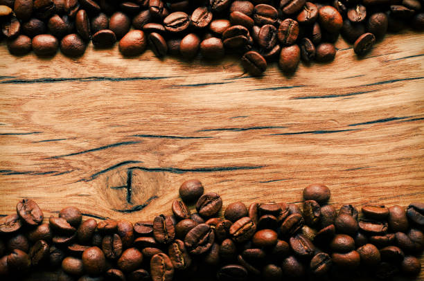 istock Coffee beans on grunge wooden background 657214424