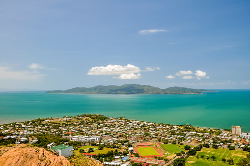 Panorama of Townsville, Queensland, Australia, with Magnetic Island in the background, seen from Castle Hill viewpoint. Magnetic Island is a popular tourist destination. Harbour and beaches.