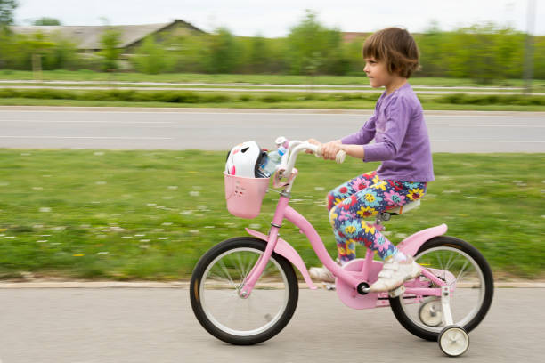 istock Girl learning to ride her bike 657220264