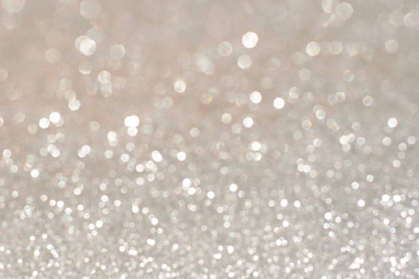istock Silver glittering christmas lights. Blurred abstract holiday background 657220460