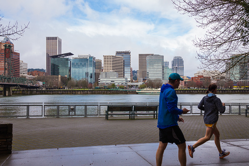 Portland, DeepMeta.Shared.Country: Runners and walkers make use of the waterfront trail system in downtown Portland Oregon.