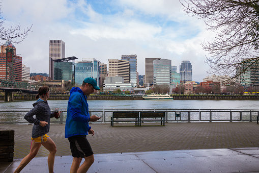 Portland, DeepMeta.Shared.Country: Runners and walkers make use of the waterfront trail system in downtown Portland Oregon.