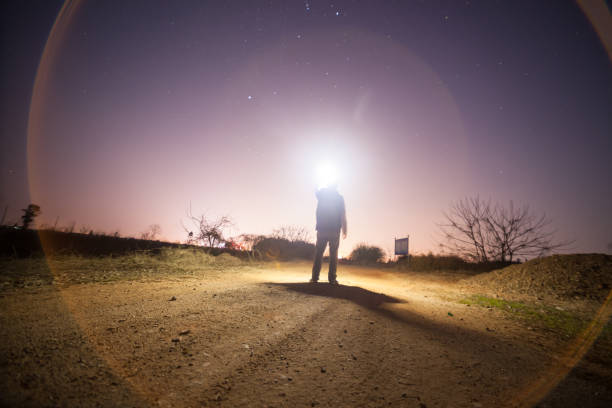 istock one young adult standing under sky at night 657233156