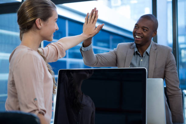 istock Business executives giving high five each other 657243230