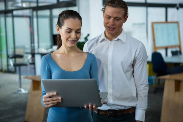 istock Business executives discussing over laptop 657243380