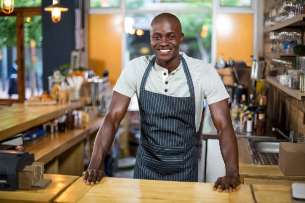 istock Portrait of waiter standing at counter 657252296