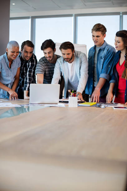 istock Creative business team looking at presentation in laptop 657255766