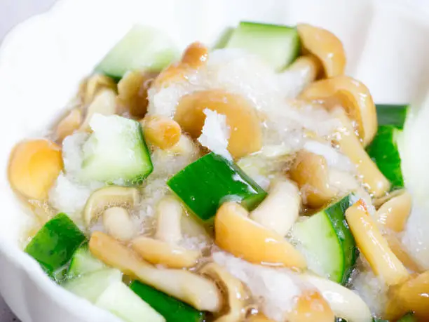 Japanese cuisine, slimy nameko mushroom and cucumbers salad in the bowl