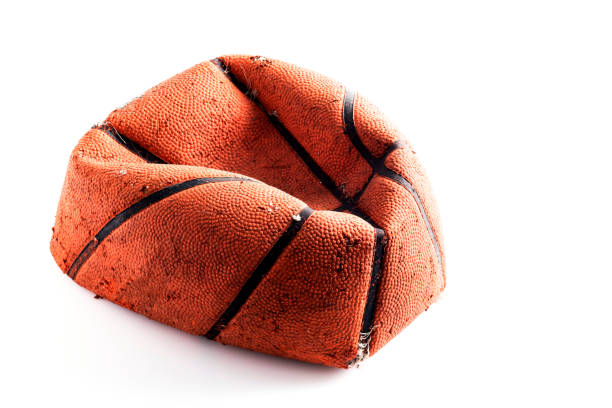 istock Old damaged rubber basket ball on background 657262306