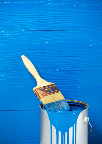 istock Paint brush in blue color oil paint can 657264616