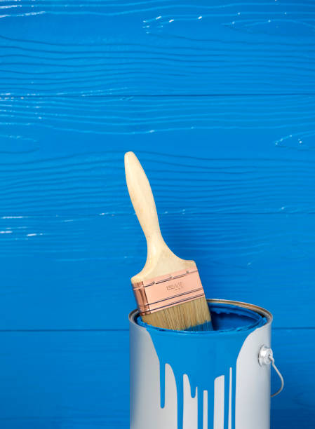 istock Paint brush in blue color oil paint can 657264618