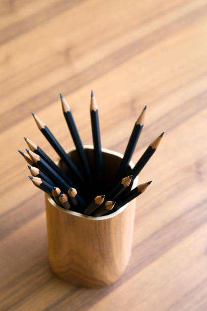 istock Black pencil in wooden storage 657264854