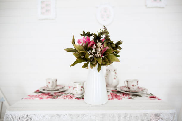 istock bouquet of flowers on table. White background. Vintage style. 657270838