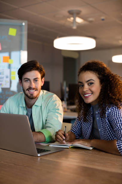 istock Creative business people working on desk at office 657273602
