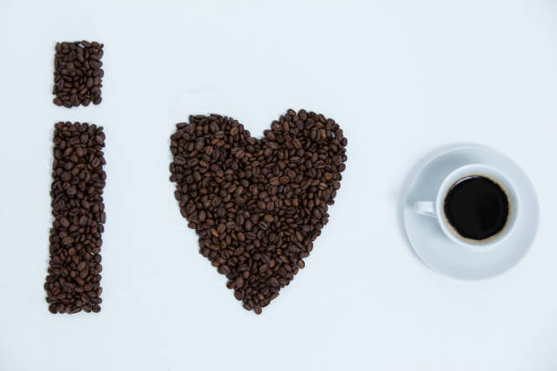 istock Coffee beans and cups forming I love, addiction coffee 657274372