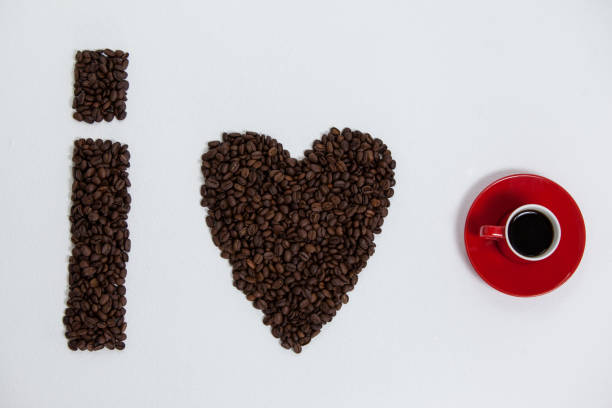 istock Coffee beans and cups forming I love, addiction coffee 657274394