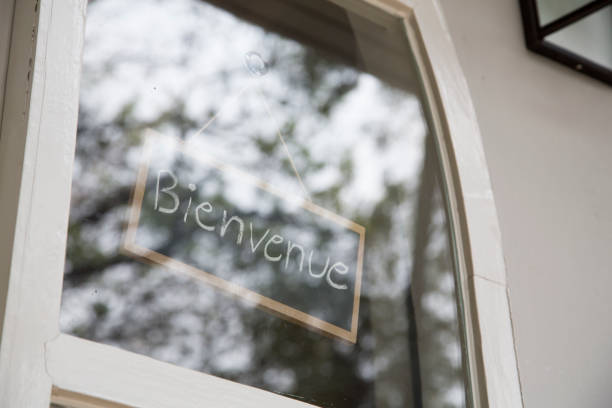 istock Bienvenue sign in glass window 657276660