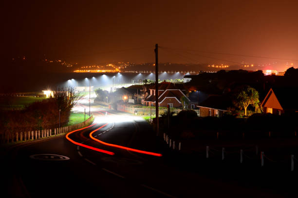 istock Car Light Trails and View of Shanklin Bay at Night 657277190