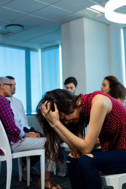 istock Woman crying while creative business team in background 657280746