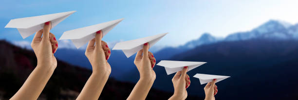 istock Paper plane holding by hand on Everest mountain view blur background 657280986