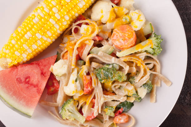 istock Vegetable Primavera with watermelon and corn up close top view 657280998