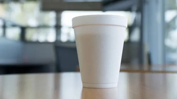 simple coffee cup on a table in open space