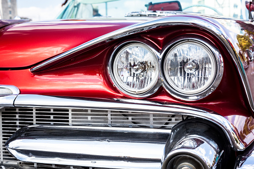 Concept of Cuba attractions. Headlight of old car in Havana, Cuba. Shallow DOF. Toned, horizontal