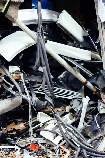 istock Stack Of Damaged Car Parts In Junkyard 657290006