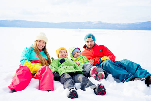 istock Family lying in snow 657292842