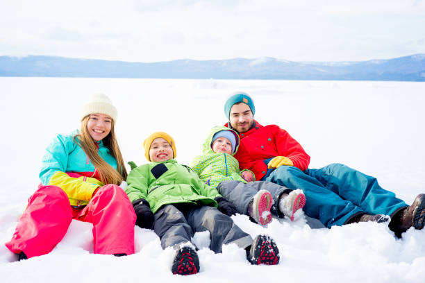 istock Family lying in snow 657292890